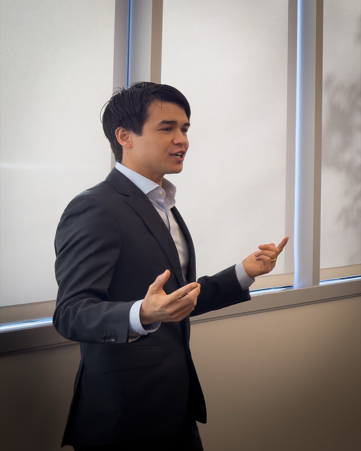 Alex del Valle, founder of Ownfri, speaking to a room